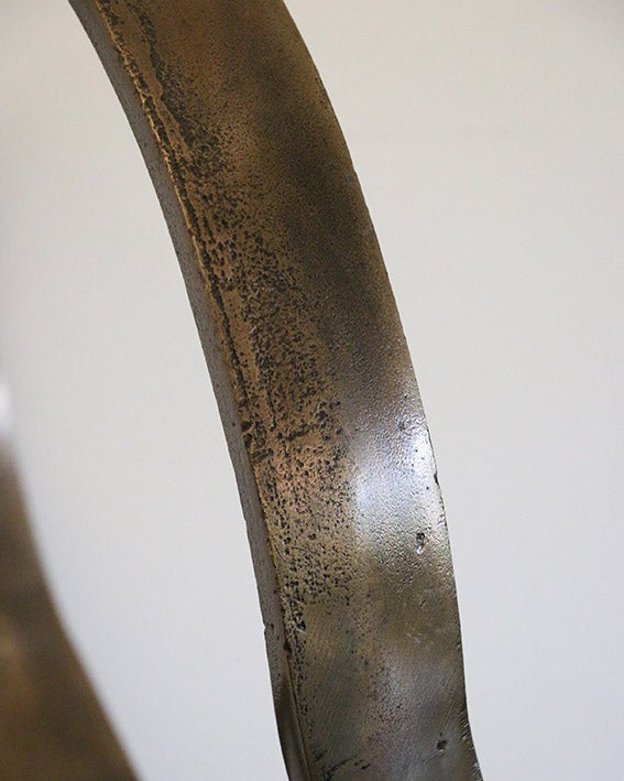 Infinity Sculpture in Antique Brass on Black Base