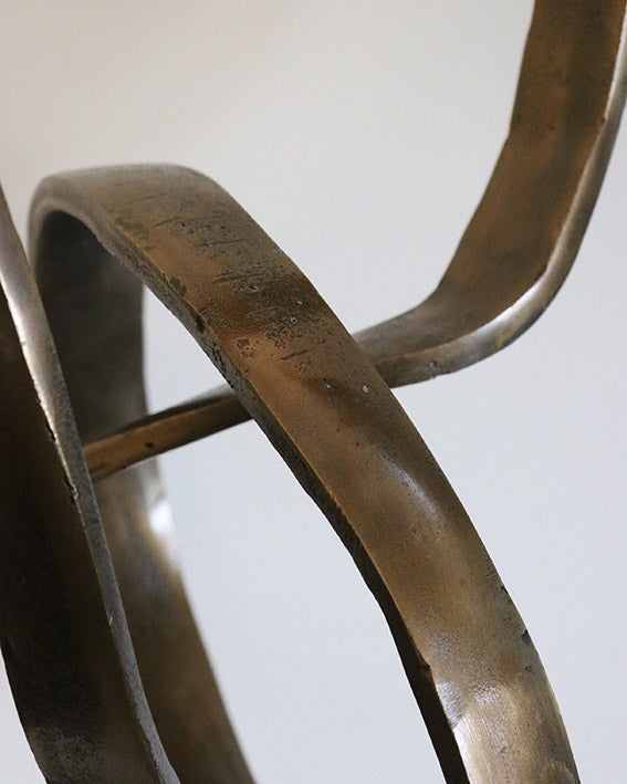 Infinity Sculpture in Antique Brass on Black Base