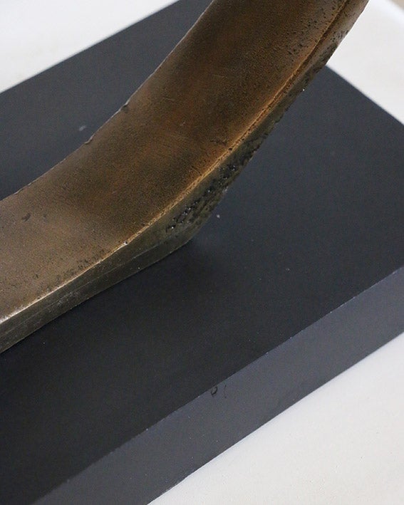 Infinity Sculpture in Antique Brass on Black Base