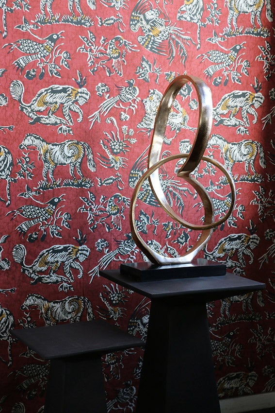 Infinity Sculpture in Antique Brass on Black Base