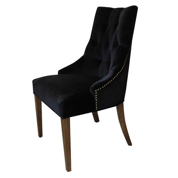 LIVINIA DEEP BUTTON CHAIR IN BLACK VELVET WITH WEATHERED OAK LEGS AND BRASS STUDS
